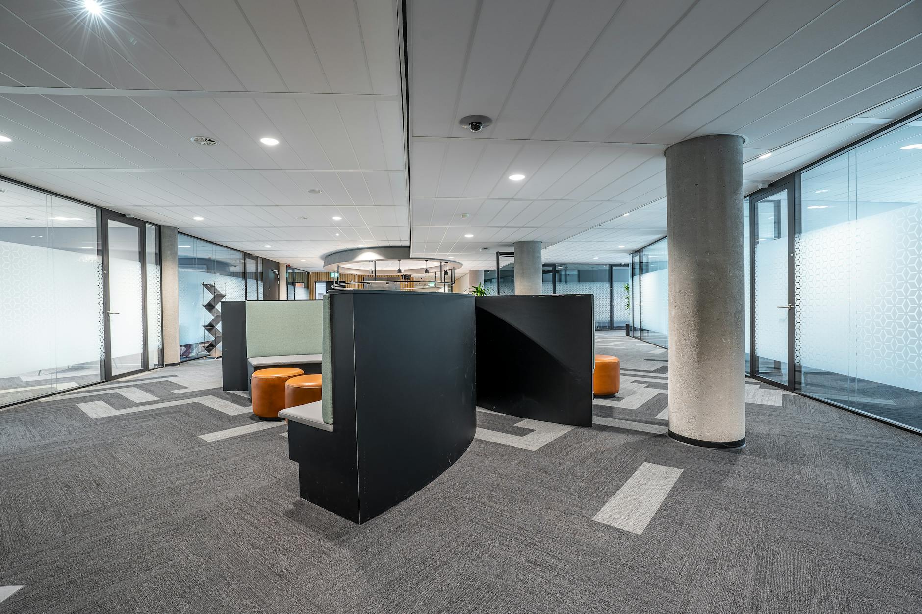 Modern bank interior with teller counters and professional lighting