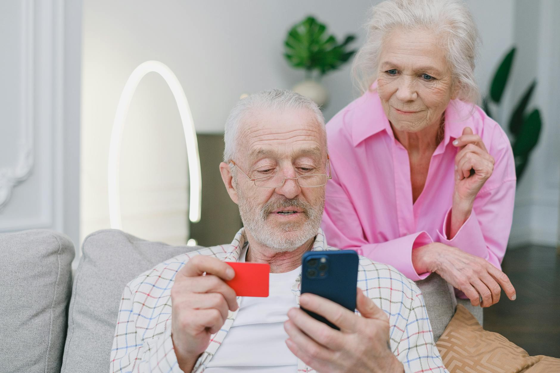 Senior couple reviewing financial documents and investment statements