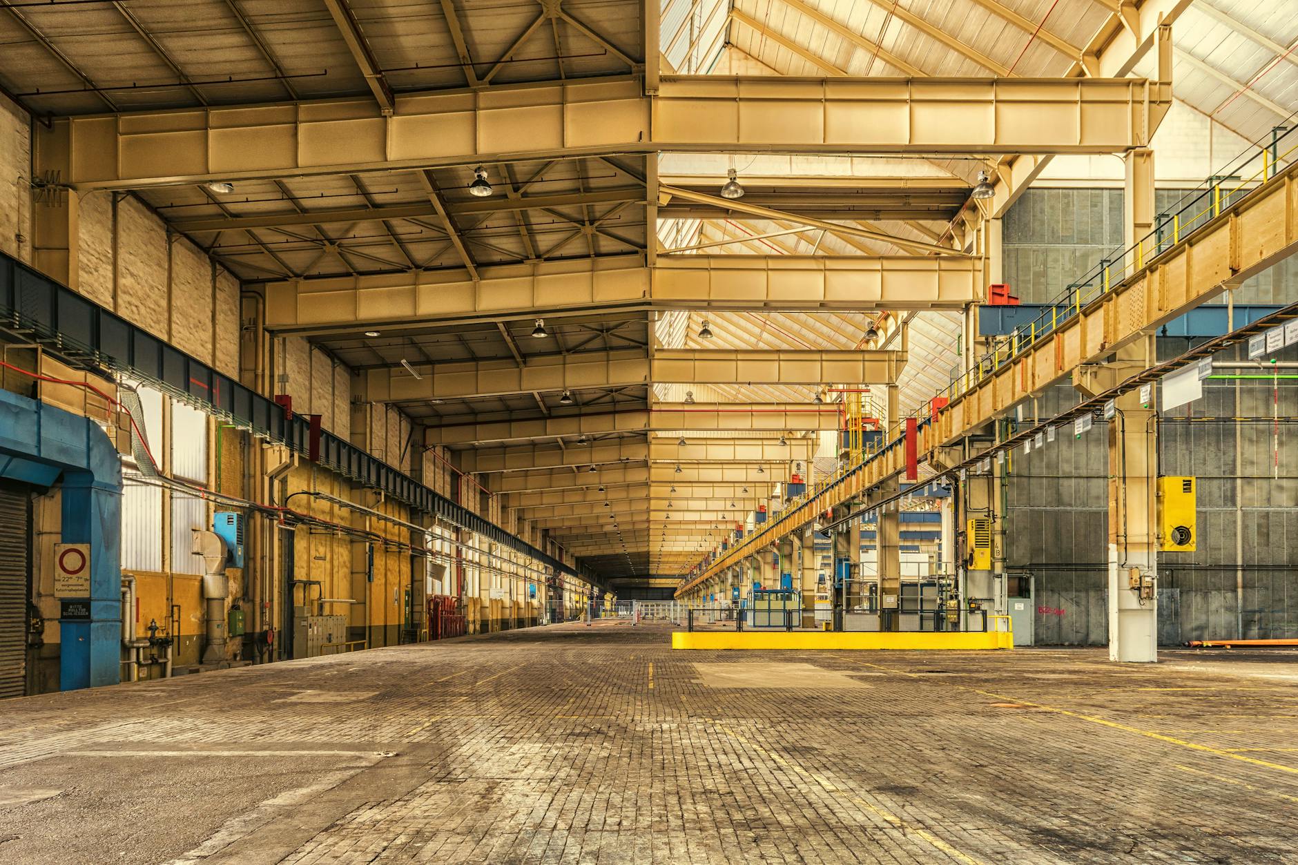 Large industrial warehouse interior with stacked materials and storage systems