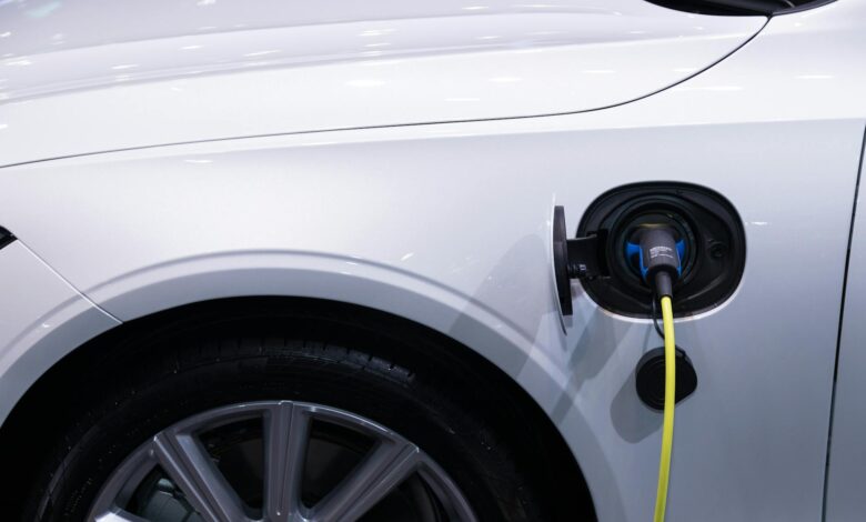 Electric vehicle charging at modern charging station with multiple charging ports