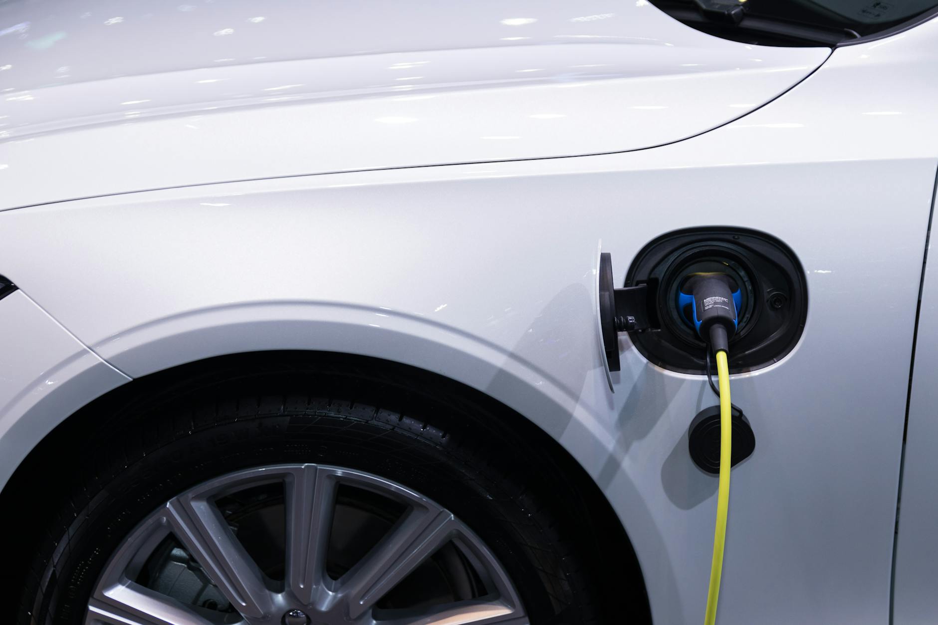 Electric vehicle charging at modern charging station with multiple charging ports