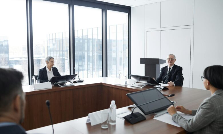 Professional business meeting in modern conference room with people discussing investment strategies