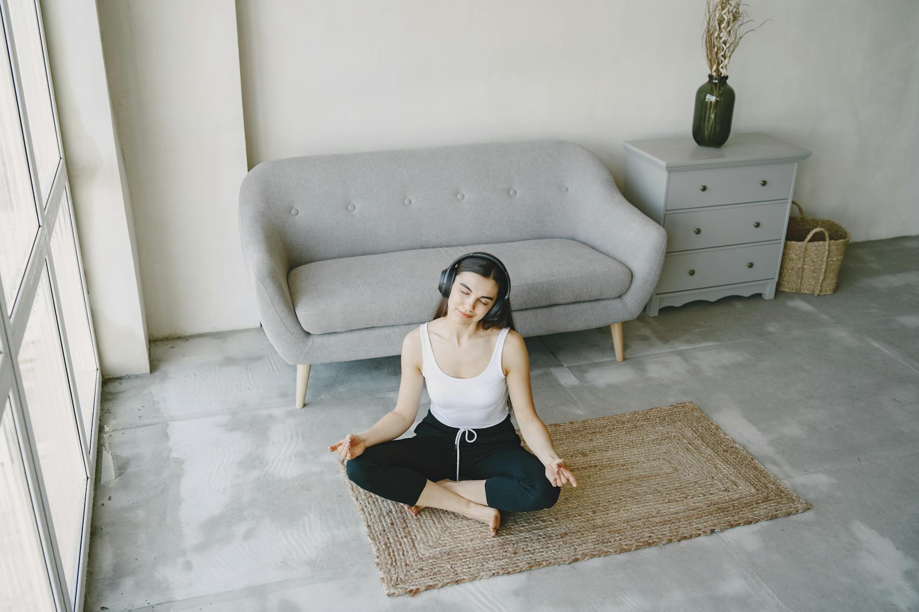 Modern office meditation and wellness space with comfortable seating and natural lighting