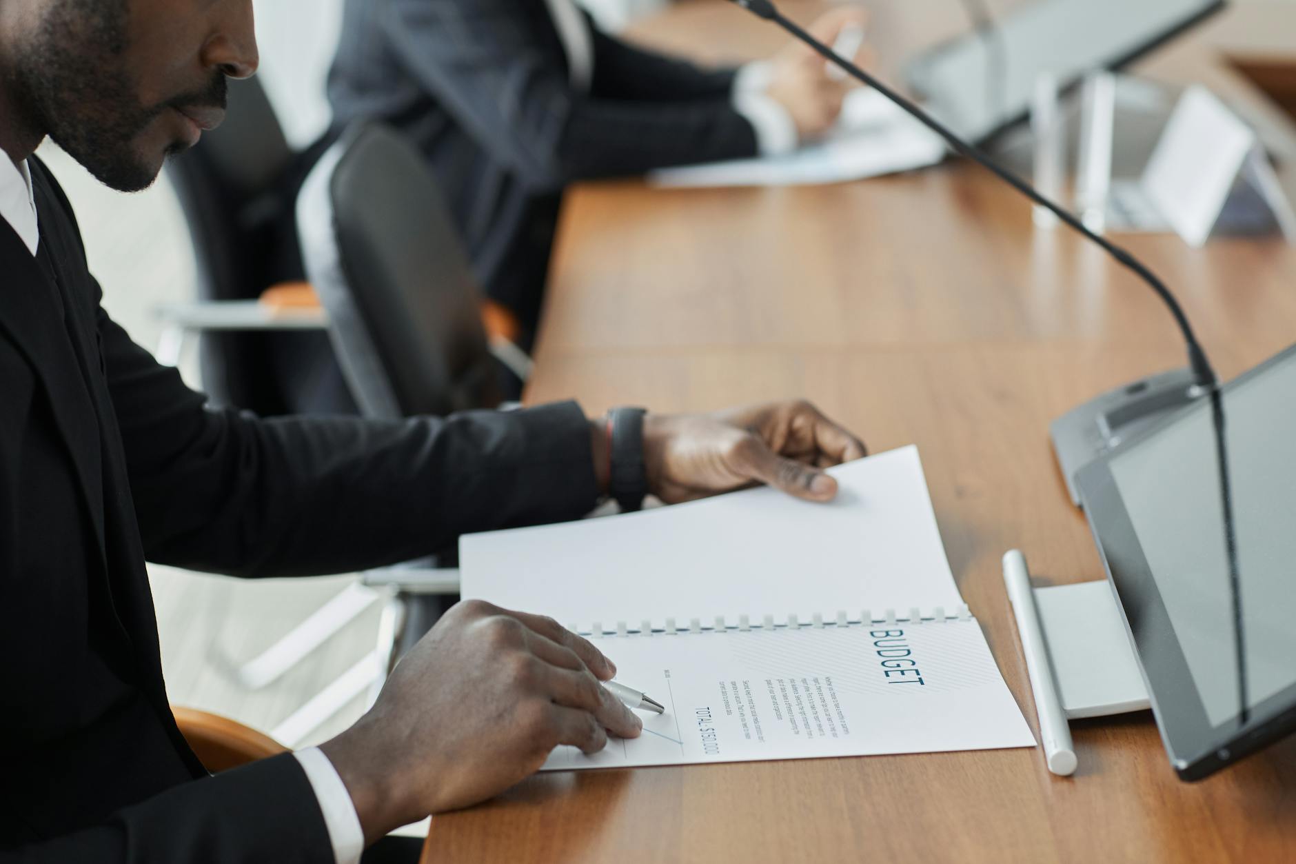 Business professionals in a boardroom meeting discussing financial strategies and wealth management