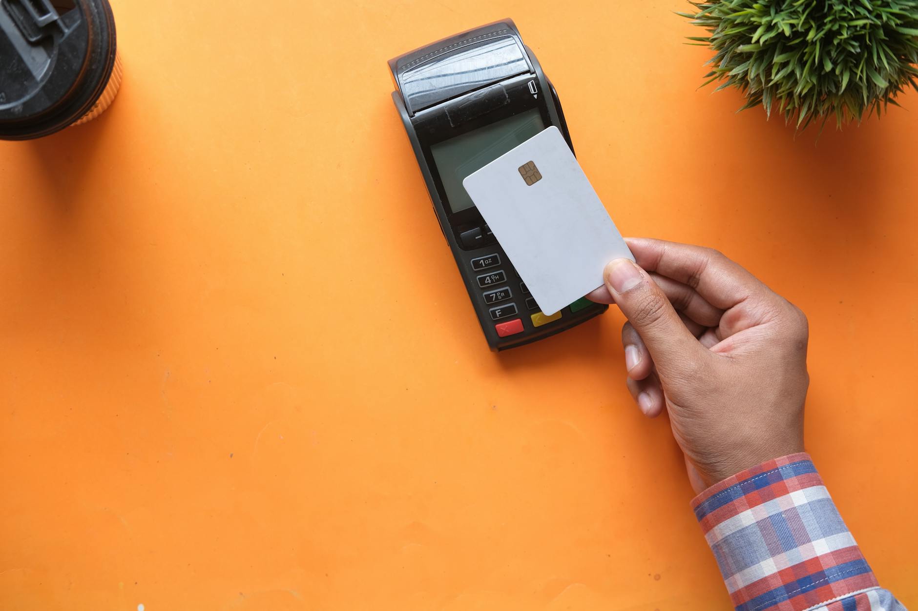 Person using credit card for online payment on laptop computer