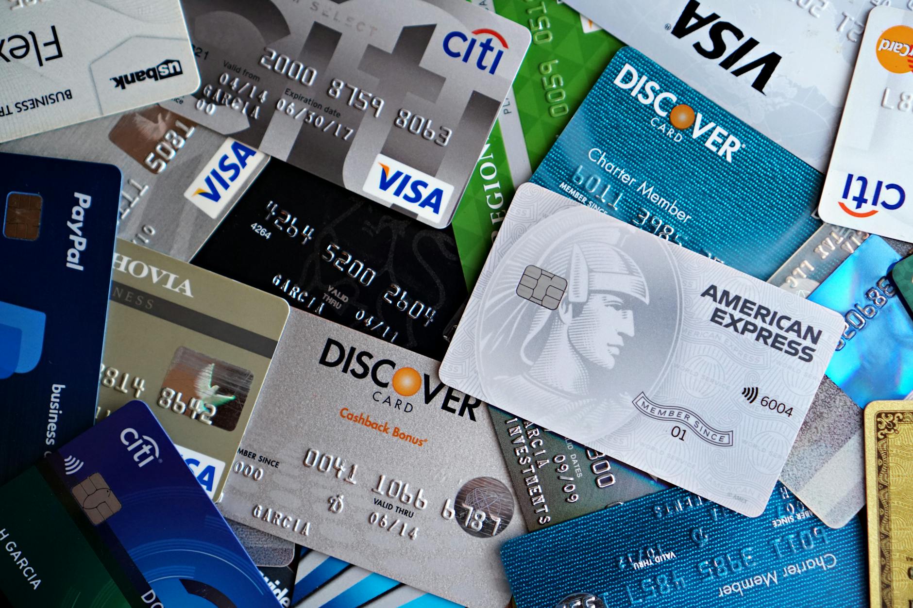 Multiple credit cards arranged on desk showing different payment options