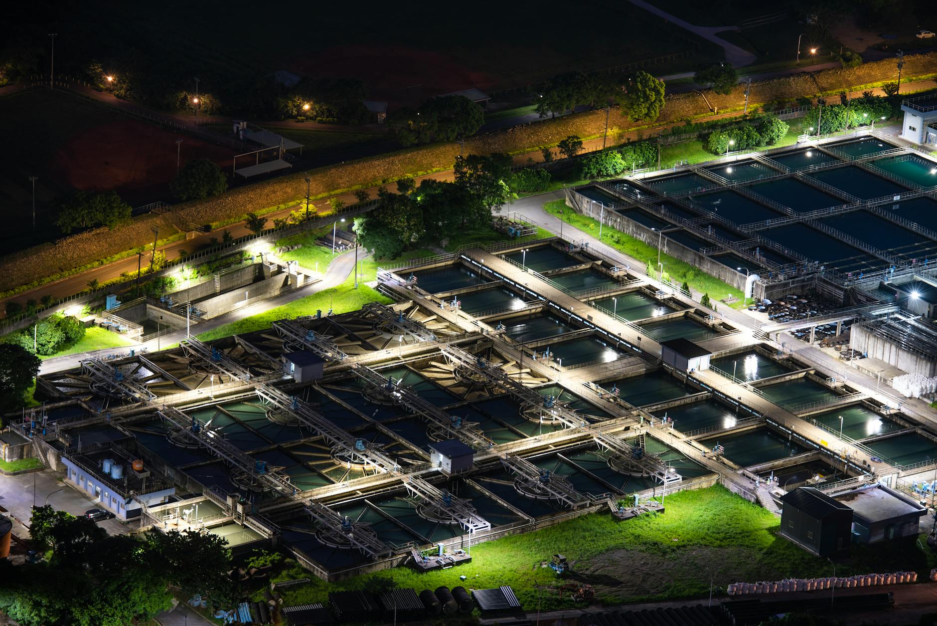 Modern water treatment facility with large pipes and industrial equipment for municipal water processing