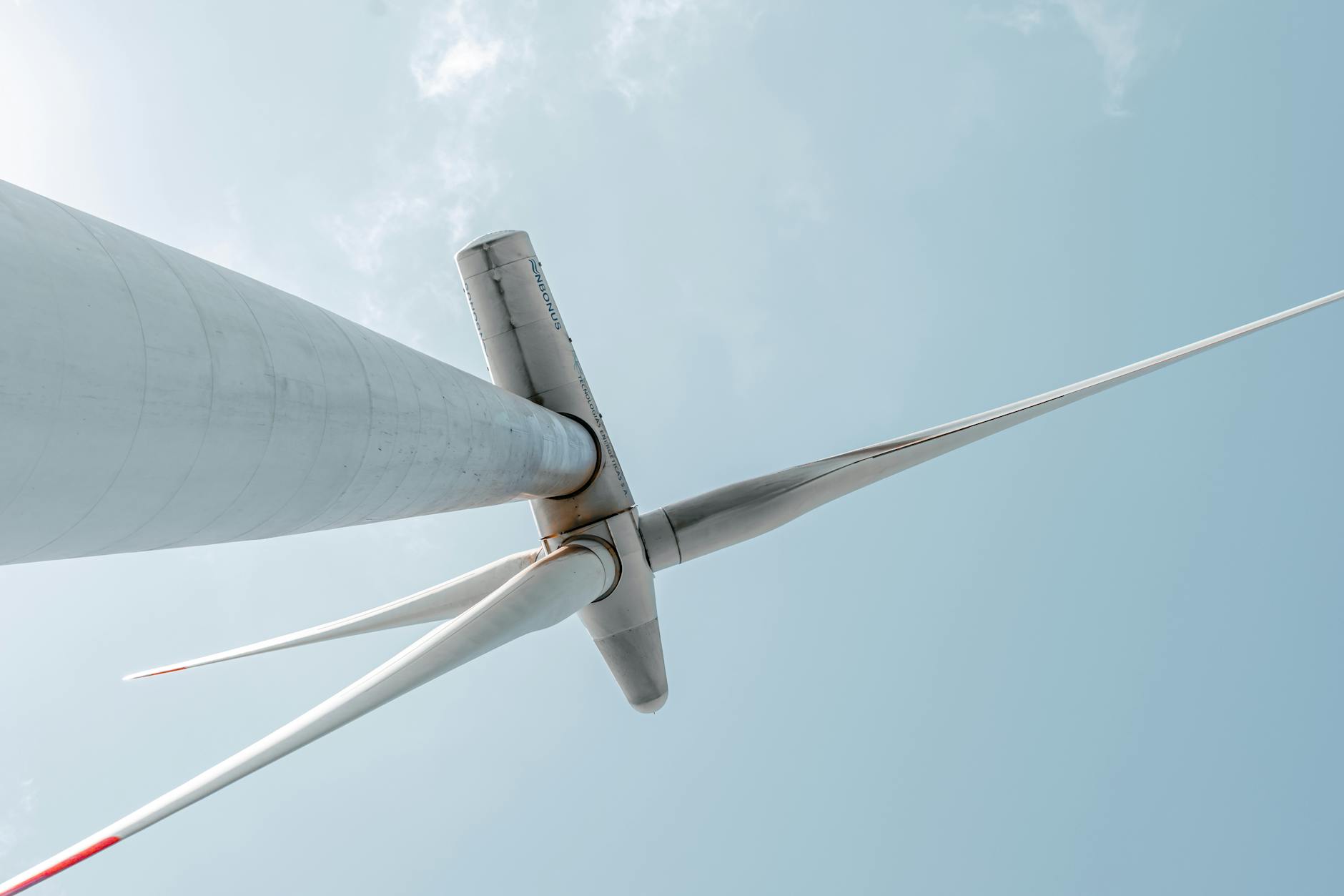 Wind turbines generating clean energy against blue sky