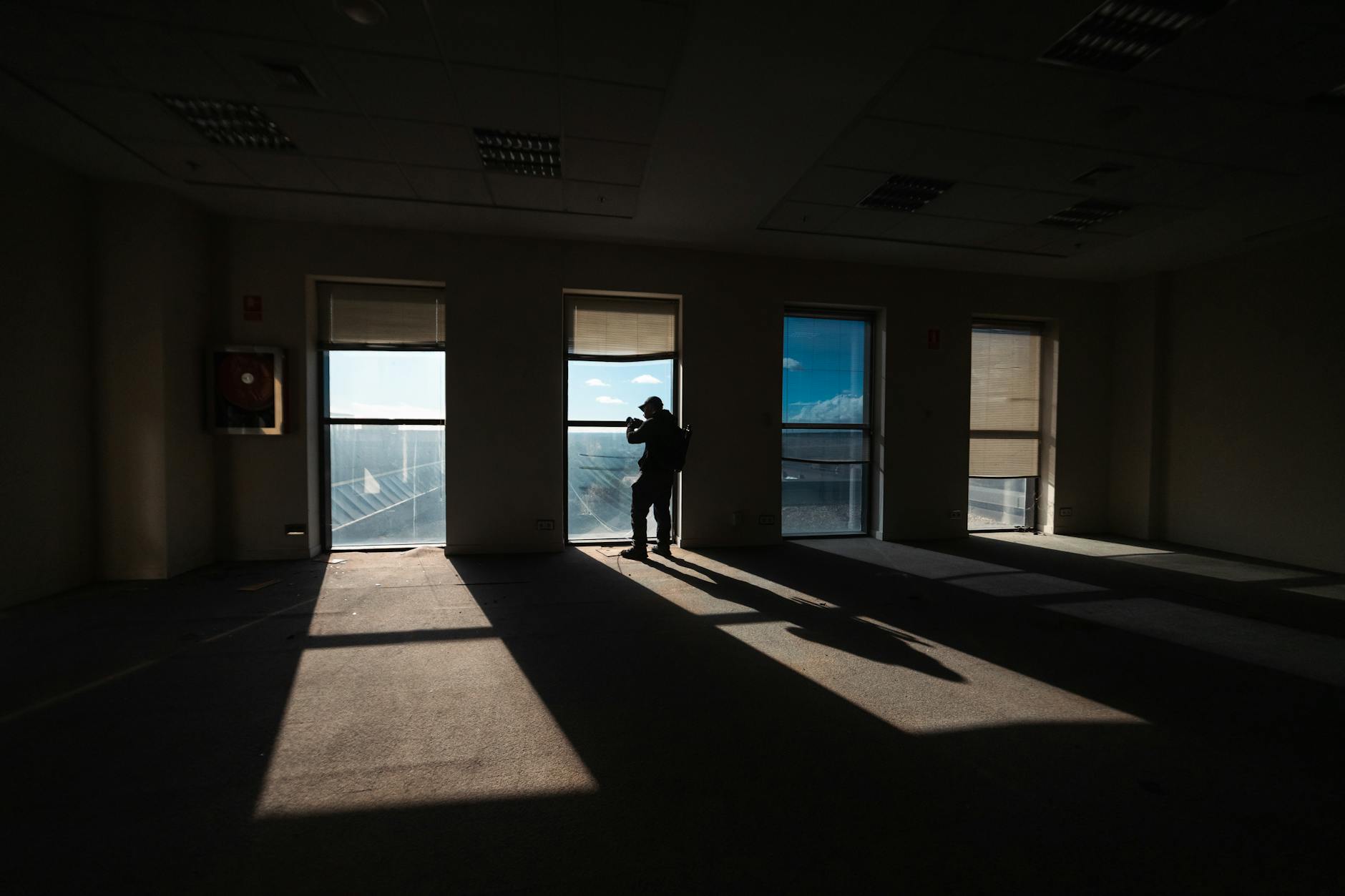 Empty modern office space with vacant desks and chairs