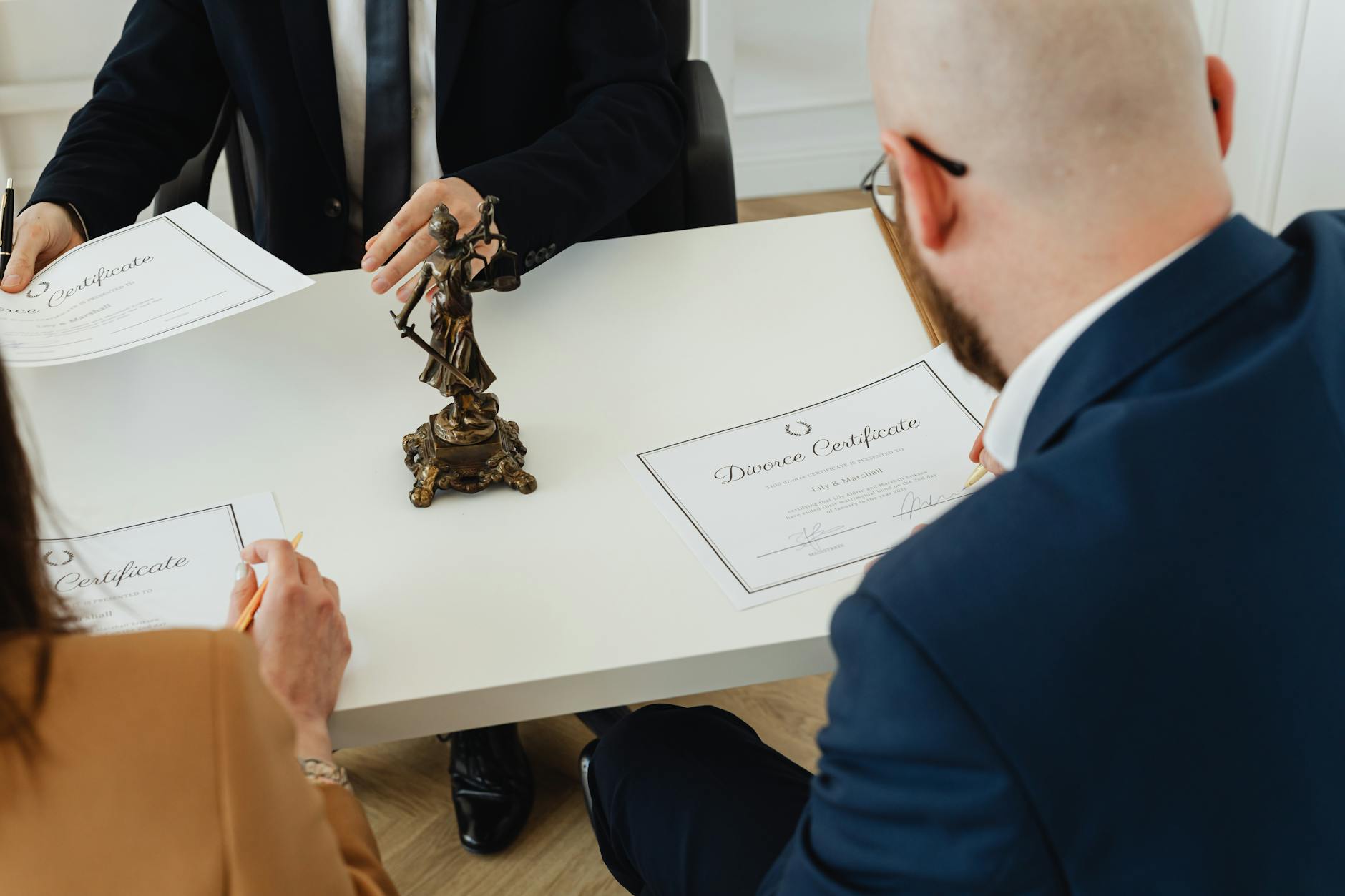 Legal documents and compliance paperwork spread across office desk