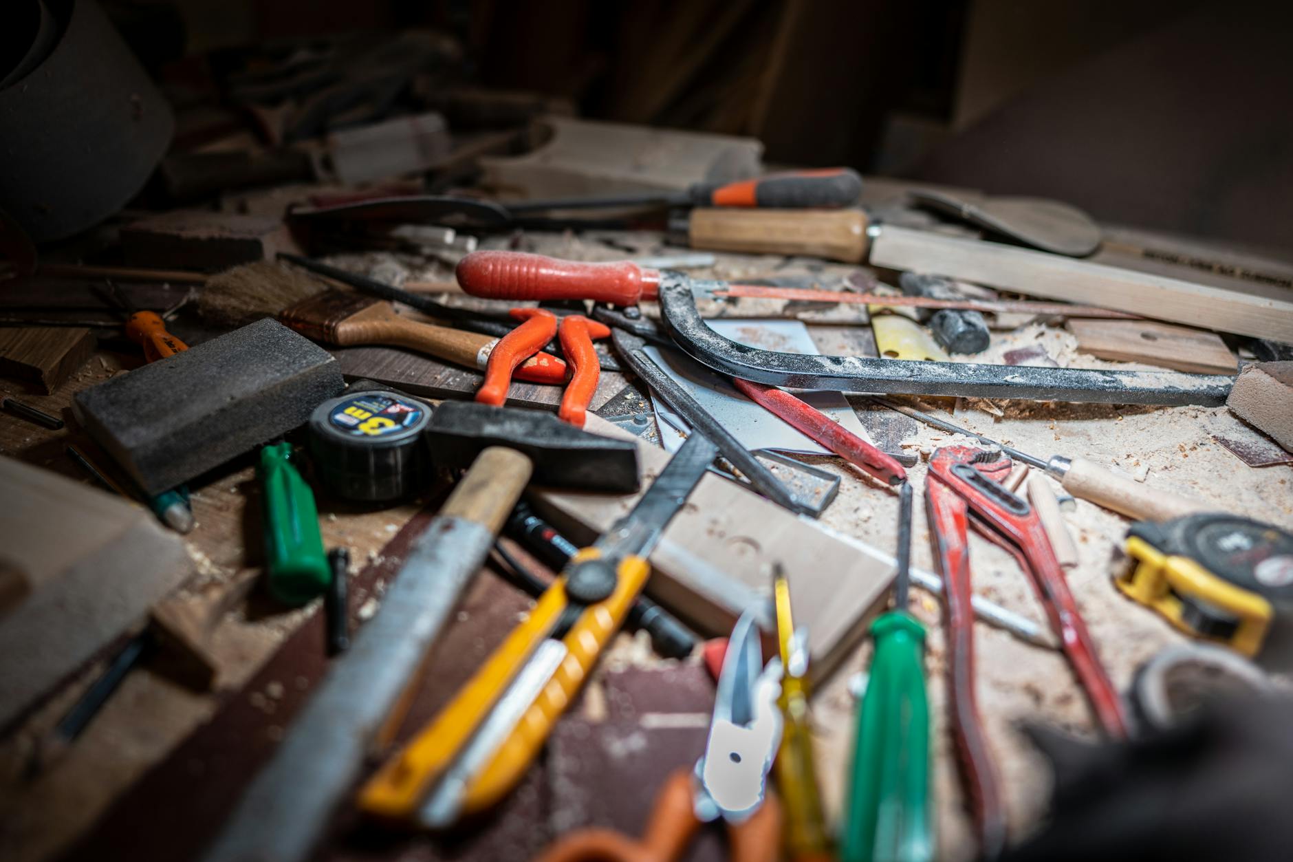 Hands using tools for home repair work, showing traditional skills monetization