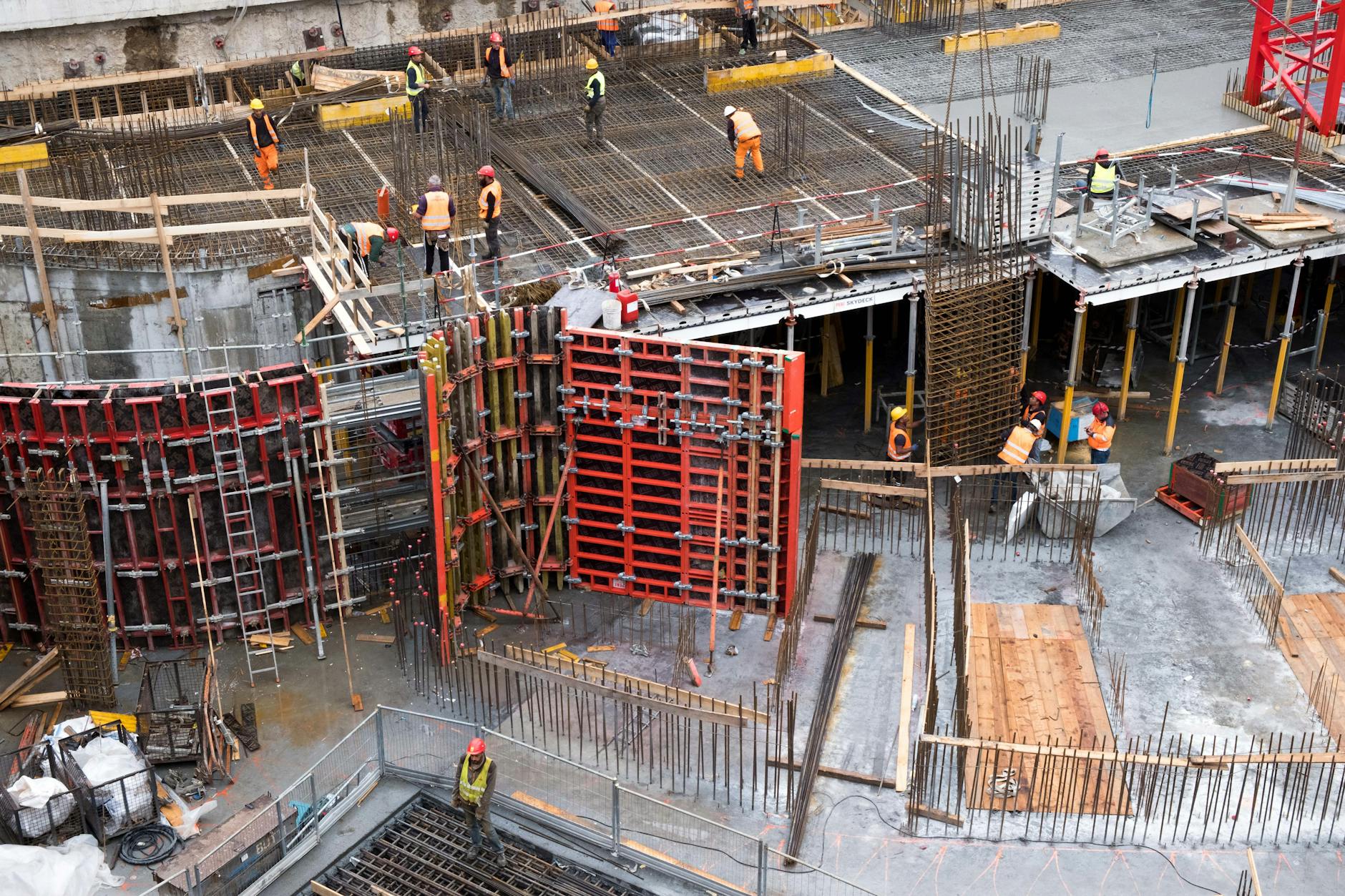 Active construction site with heavy equipment showing infrastructure projects funded by municipal bonds