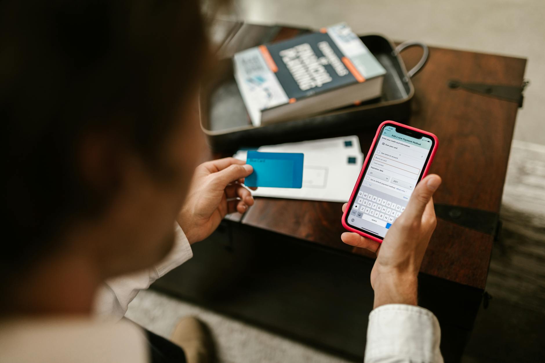 Person using smartphone to check credit card rewards and banking app interface
