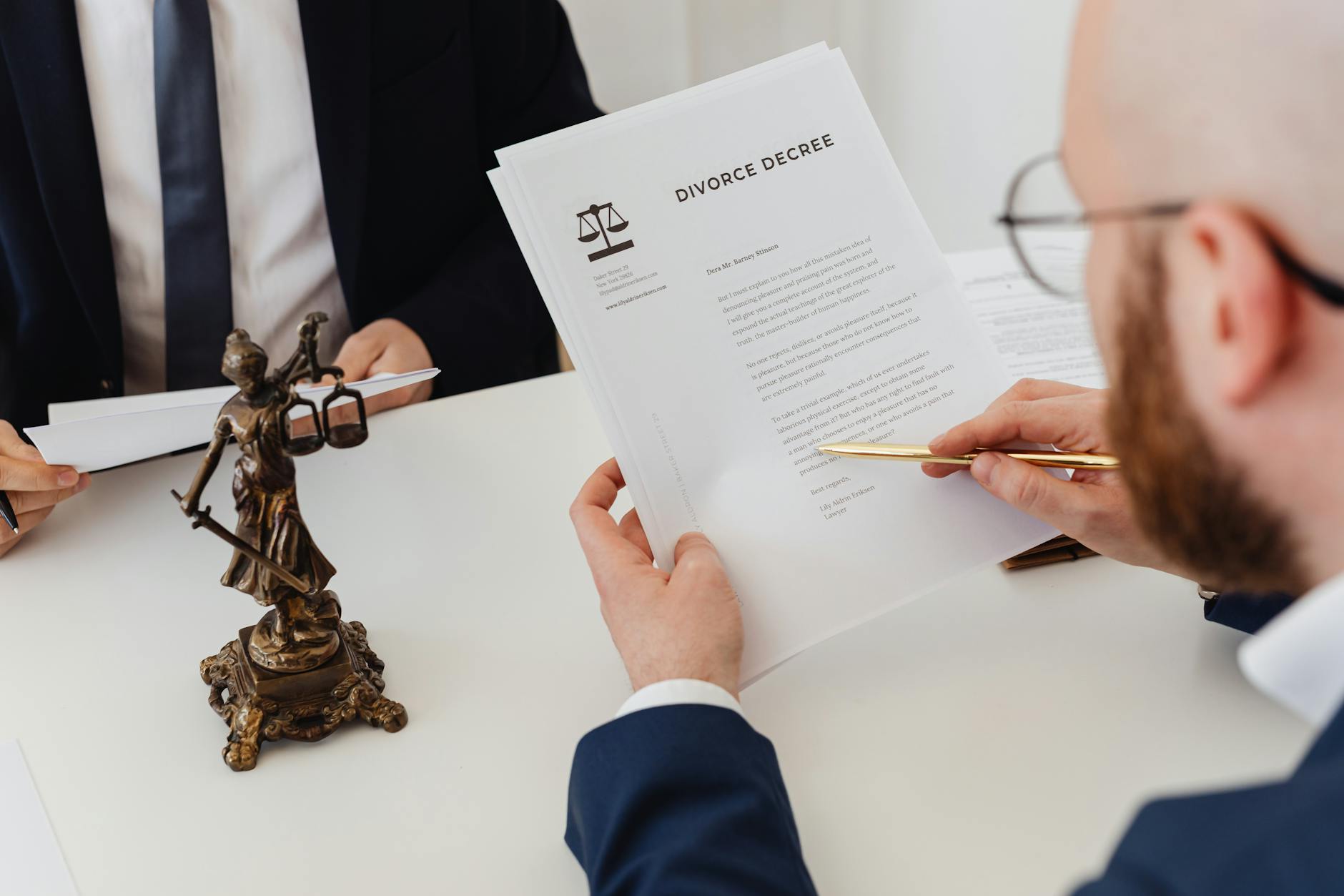 Legal documents and papers on wooden desk with gavel