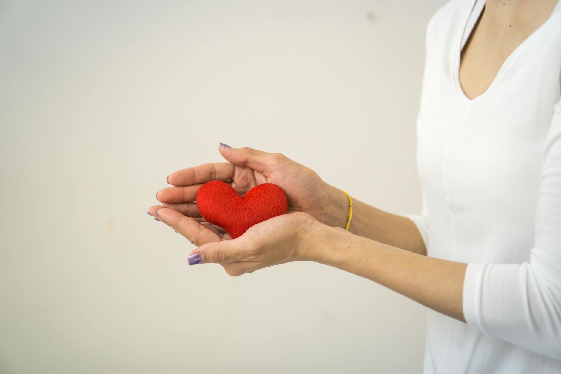 Hands representing charitable giving and philanthropy in wealth planning strategies