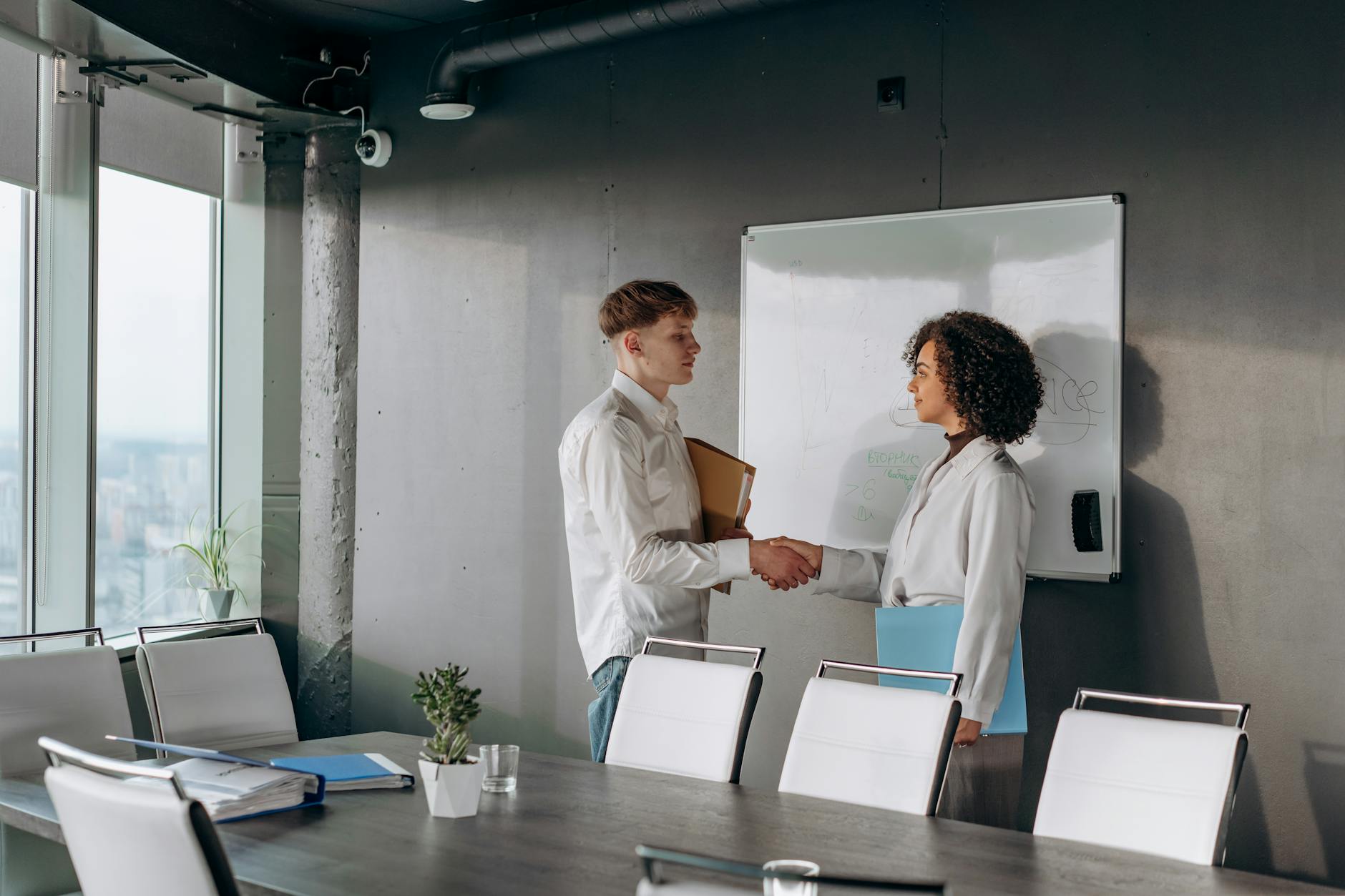 Professional handshake between banker and client during business meeting