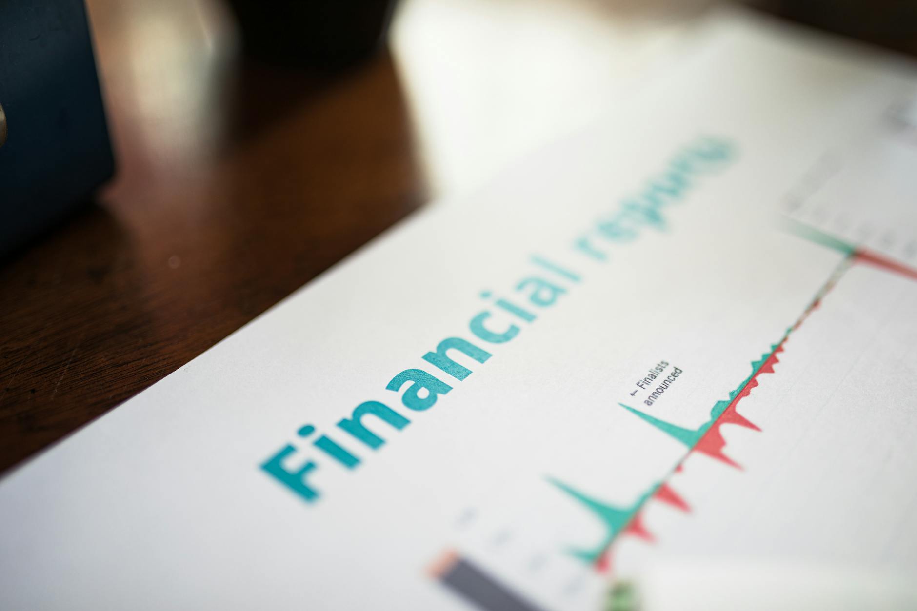 Investment charts and financial data displayed on computer screens