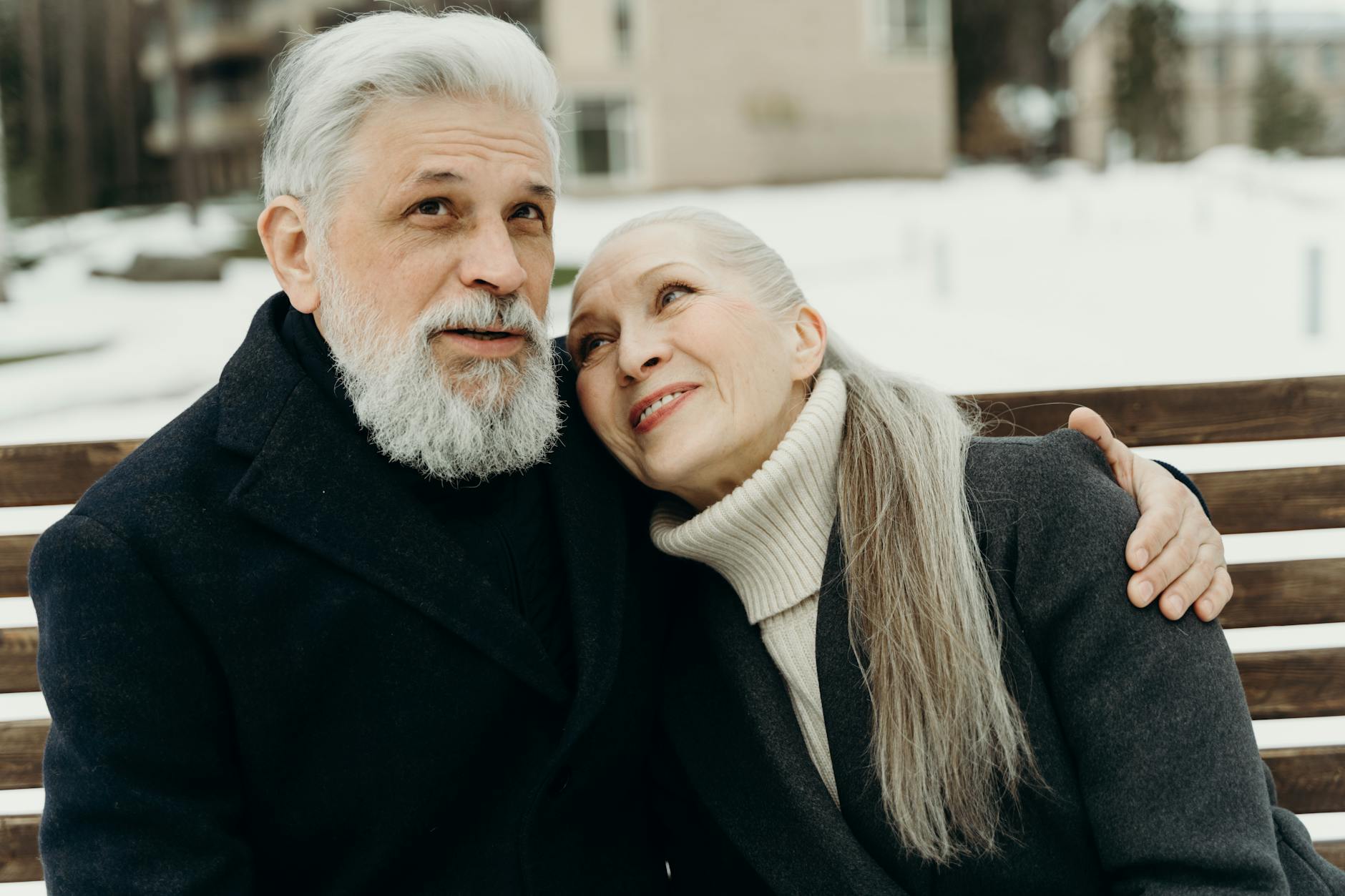 Senior couple reviewing financial documents planning for retirement security