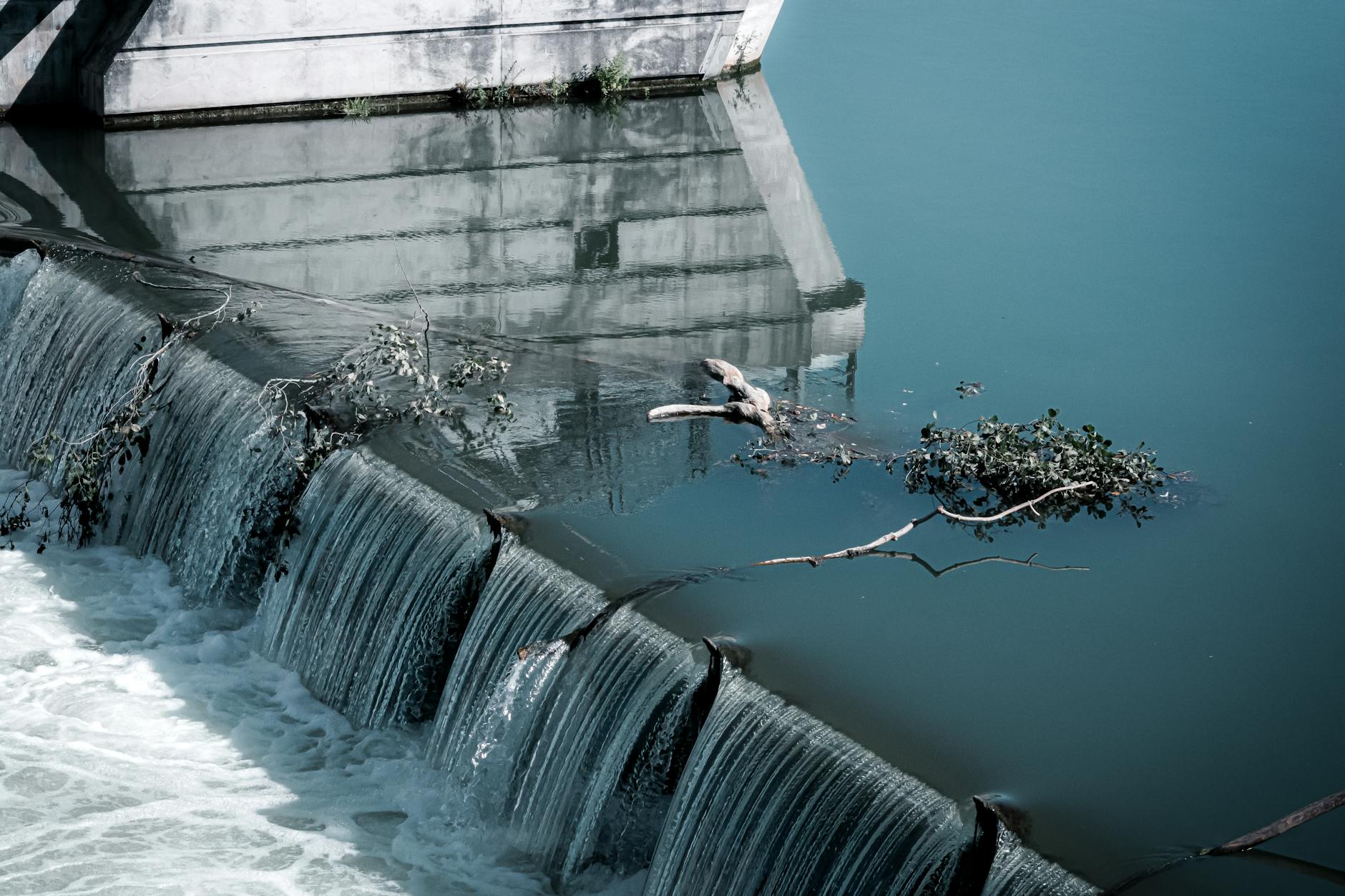 Large concrete dam and reservoir managing water resources for distribution