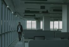 Empty commercial office building interior showing vacant floors and distressed property conditions