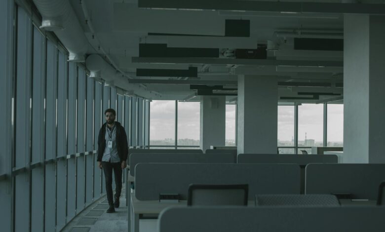 Empty commercial office building interior showing vacant floors and distressed property conditions