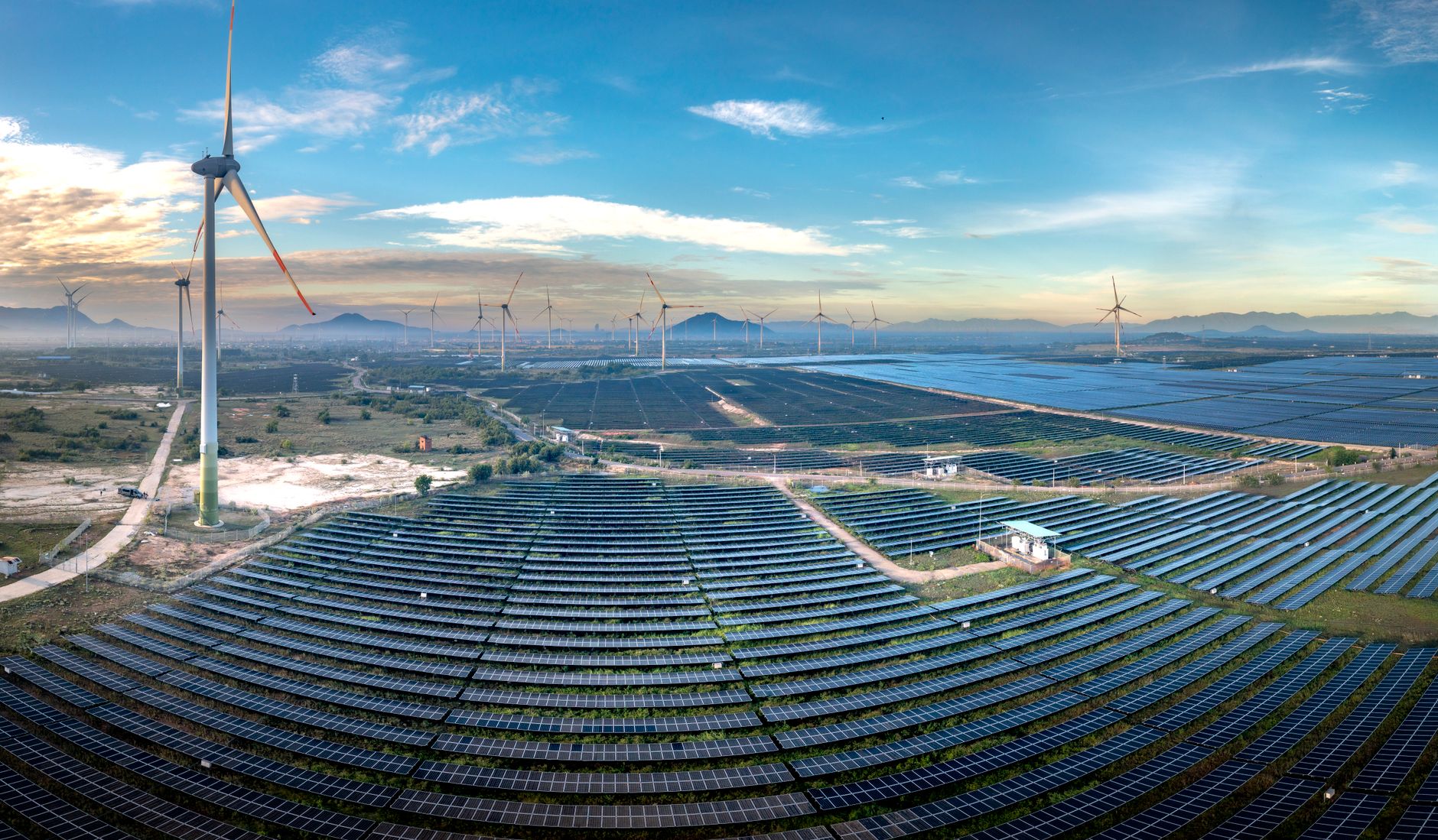 Aerial view of a large utility-scale solar farm on open land