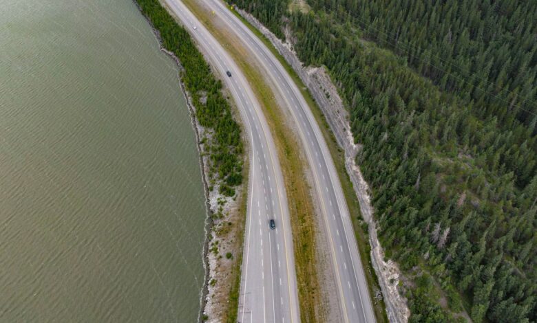 Aerial view of a multi-lane toll highway stretching through open landscape