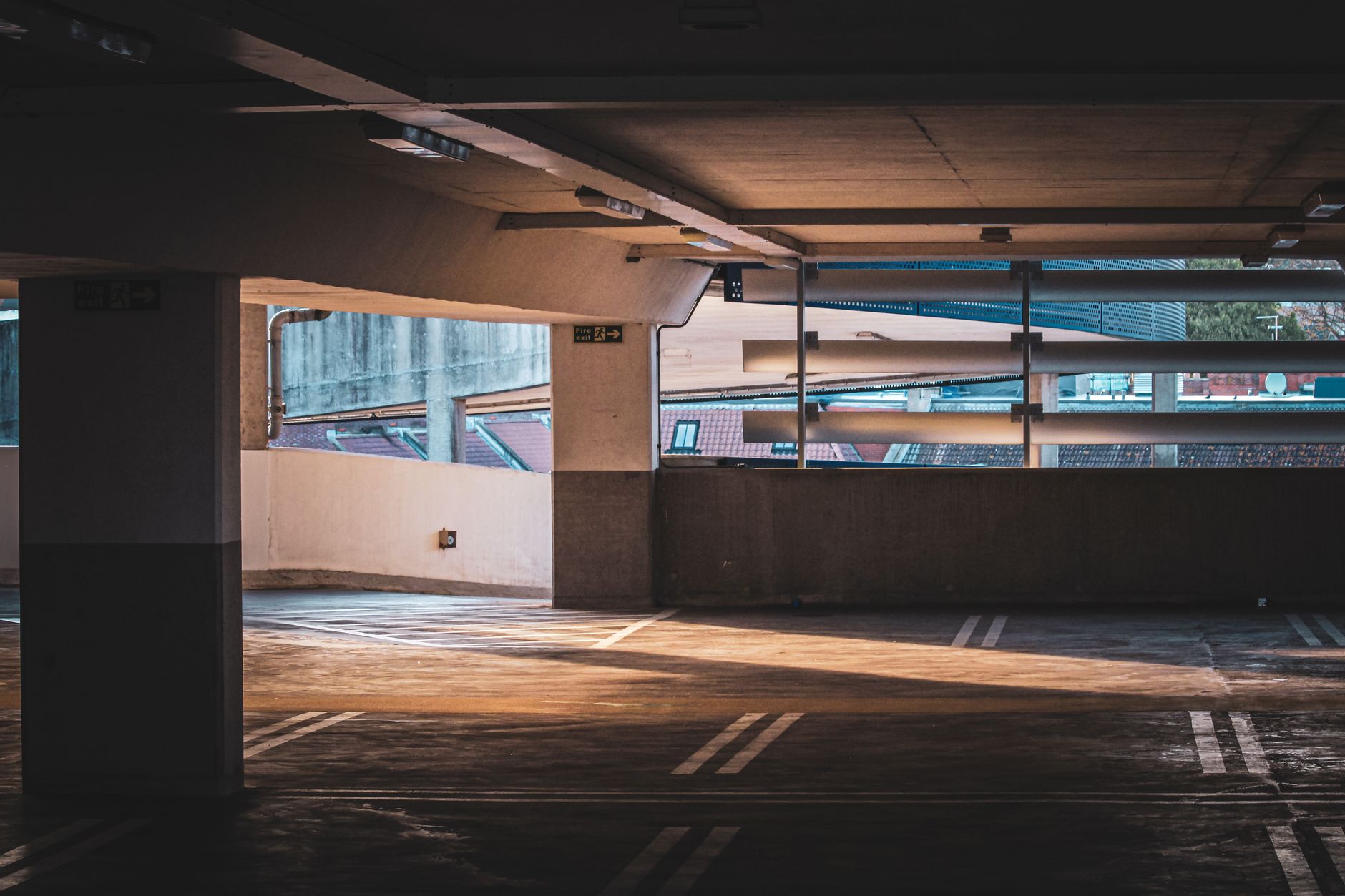Multi-level urban parking garage structure with cars on several floors