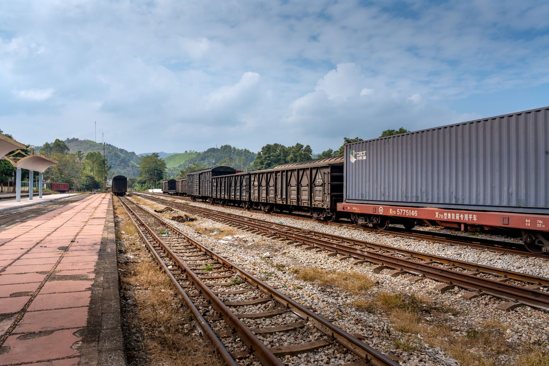 Aerial view of a freight rail terminal with intermodal containers and rail lines