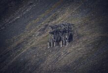 Open pit uranium mine with industrial equipment and exposed ore deposits