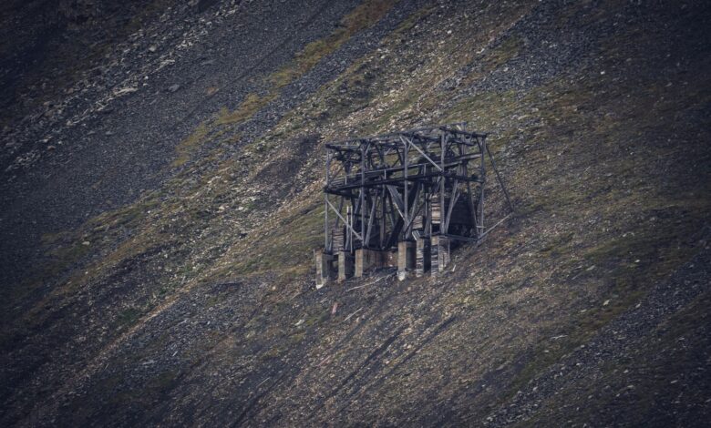Open pit uranium mine with industrial equipment and exposed ore deposits