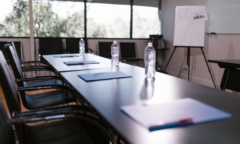 Business professionals meeting in a boardroom to discuss private investment strategy