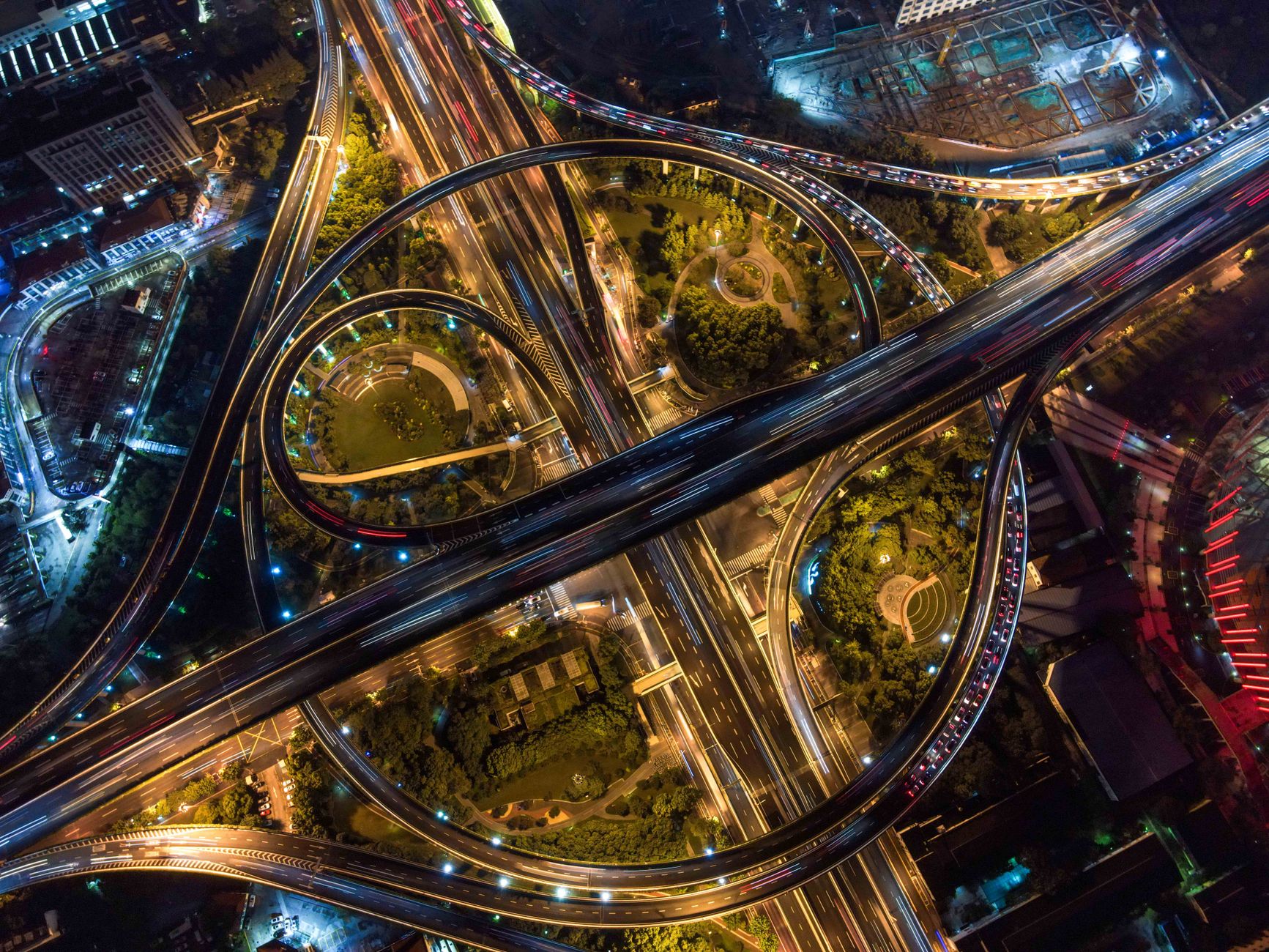 Aerial view of industrial infrastructure and pipeline corridor crossing open land