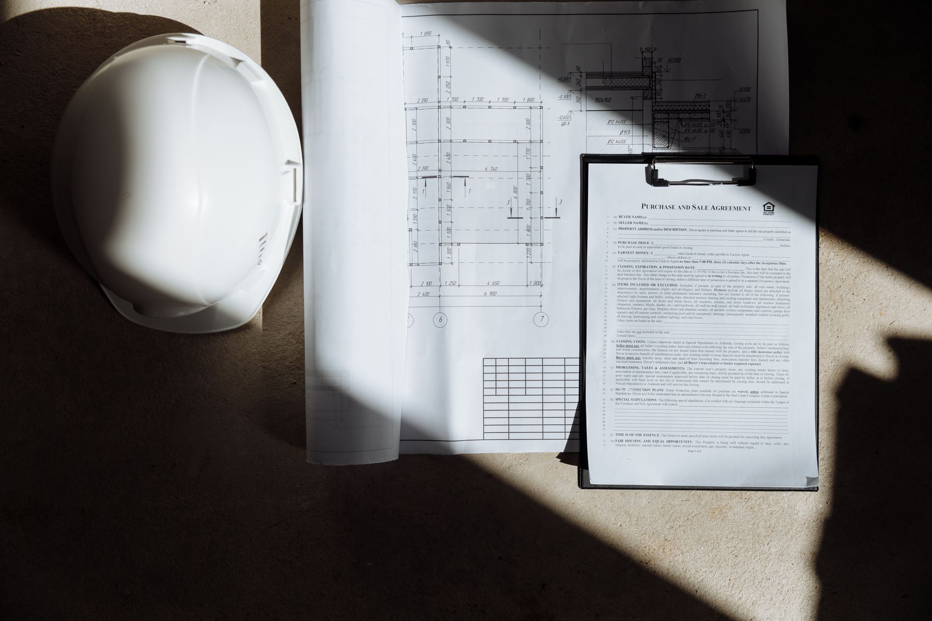 Financial analysts reviewing long-term investment fund documents at a desk