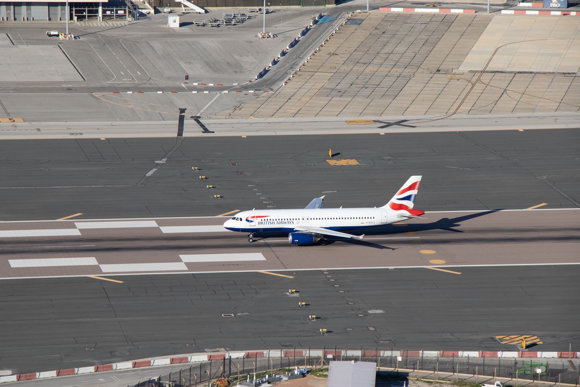 Aerial view of commercial airplanes on an airport runway