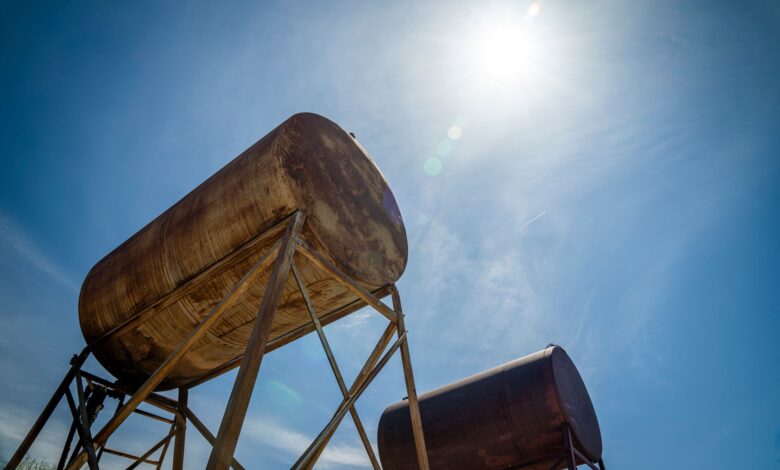 Large jet fuel storage tanks at a commercial airport facility