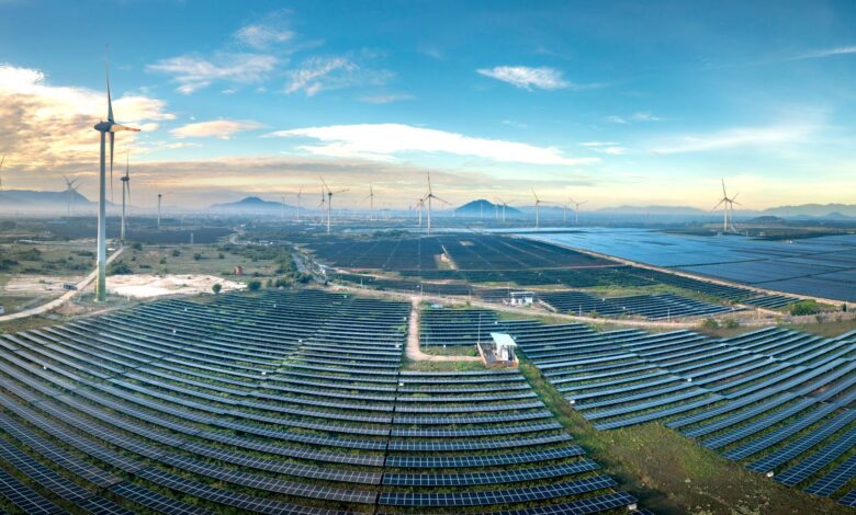 Aerial view of large solar panel installation on agricultural land