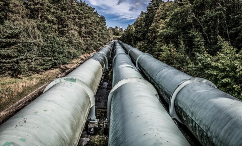 Large industrial pipeline running across open agricultural land