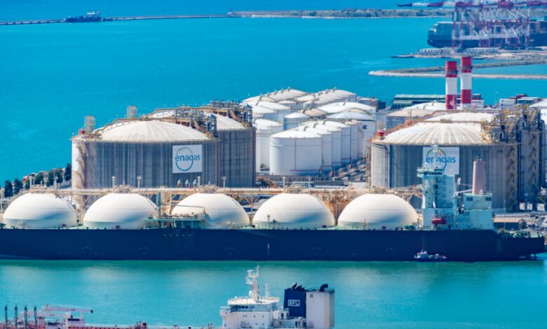 Large LNG tanker vessel docked at an industrial port terminal