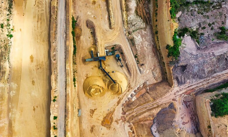 Aerial view of an open pit mining operation representing phosphate rock extraction
