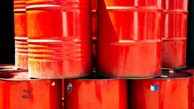 Large industrial chemical storage tanks at a port terminal facility