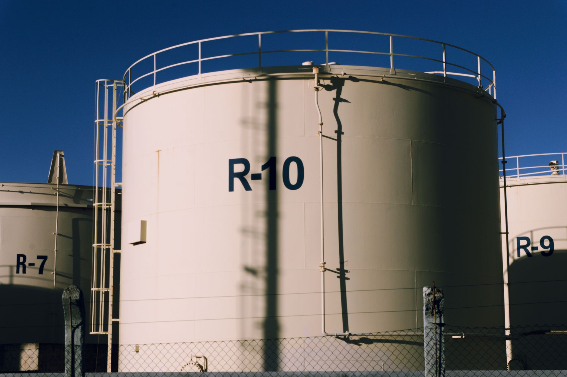 Large industrial storage tanks at a bulk liquid terminal facility