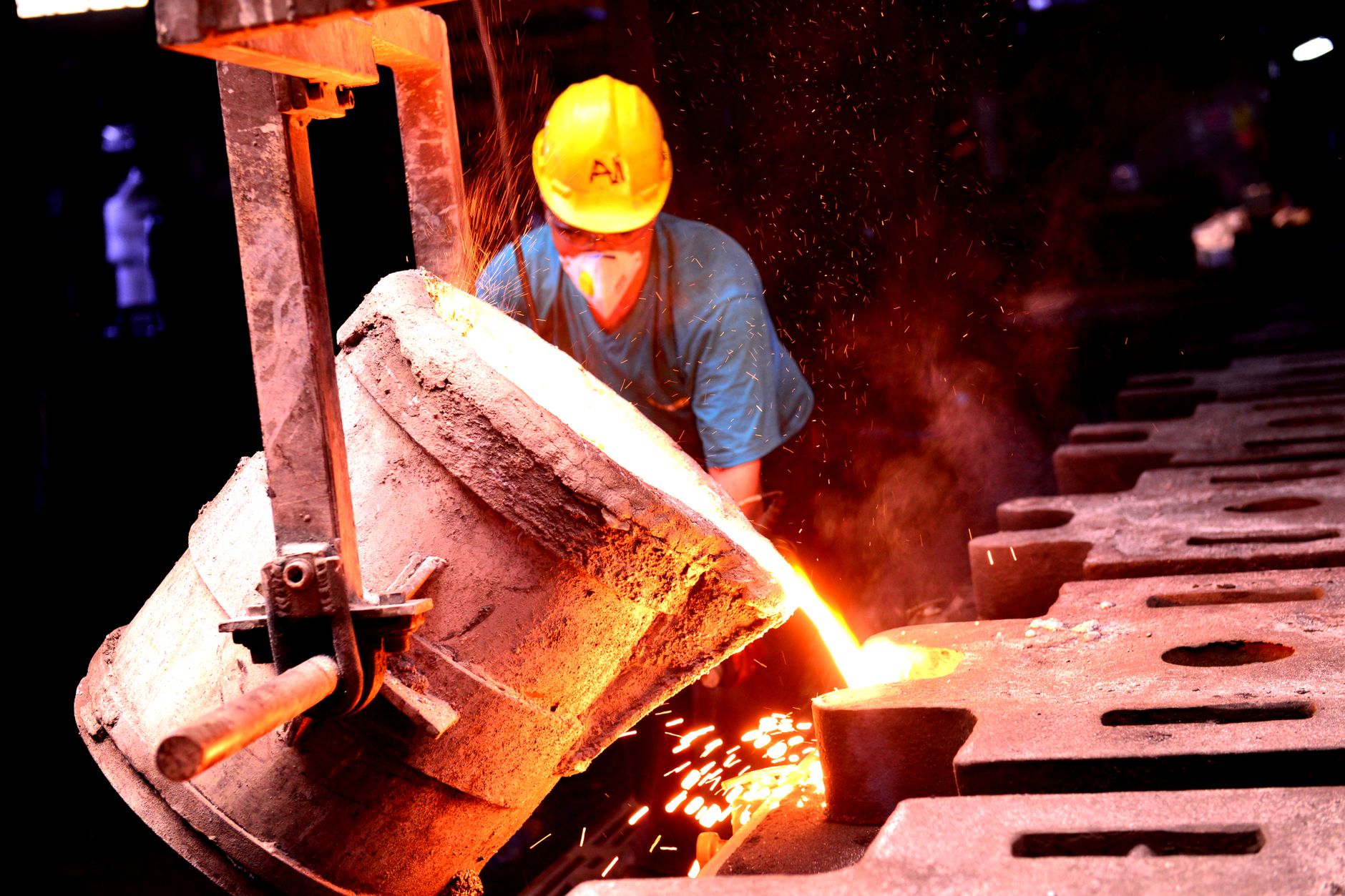 Interior of a metal smelting facility with molten material being processed