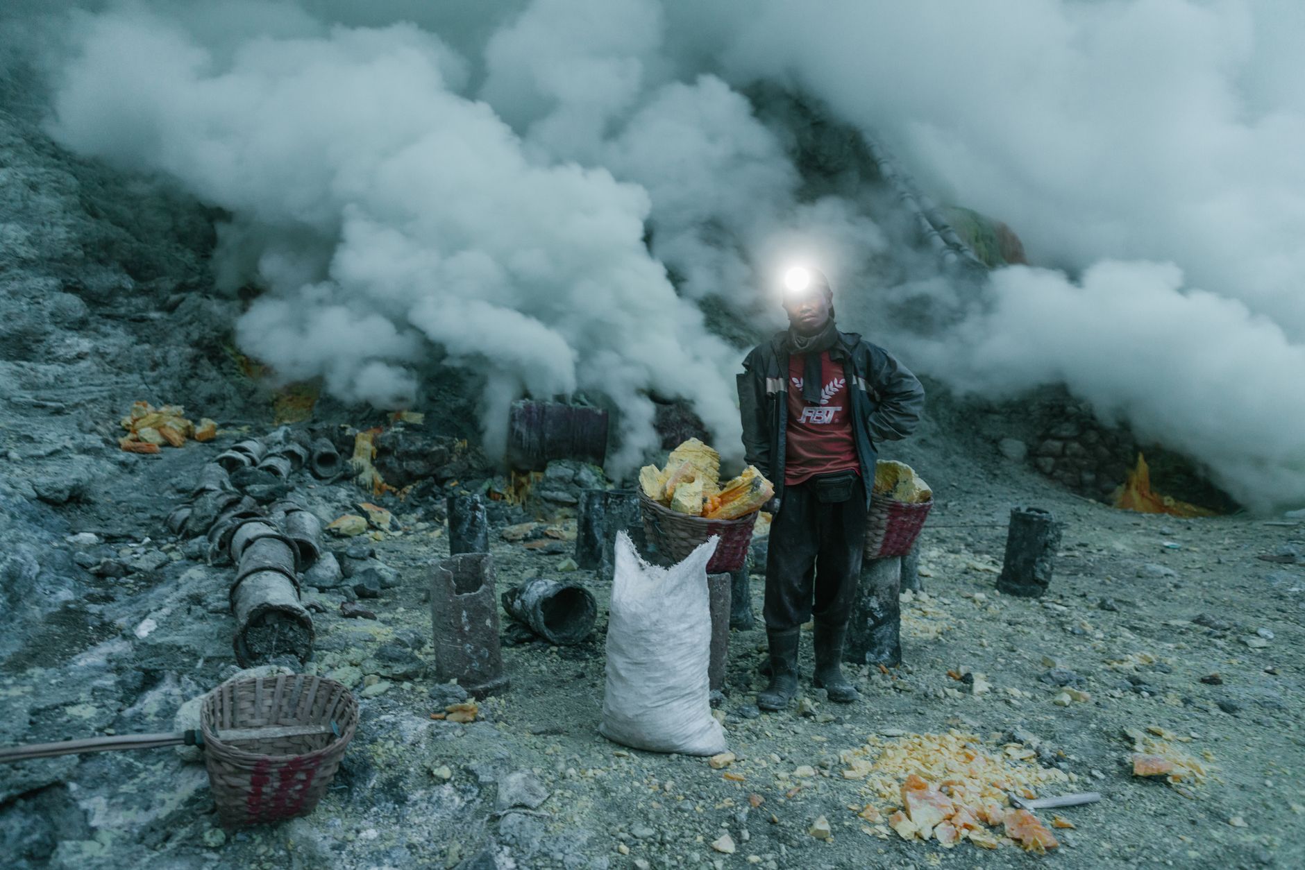Yellow sulfur mineral deposits at an industrial extraction site