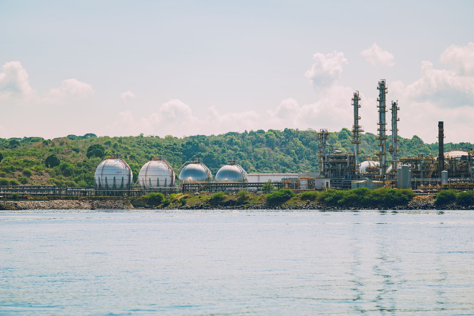 Aerial view of large chemical storage tanks at an industrial facility