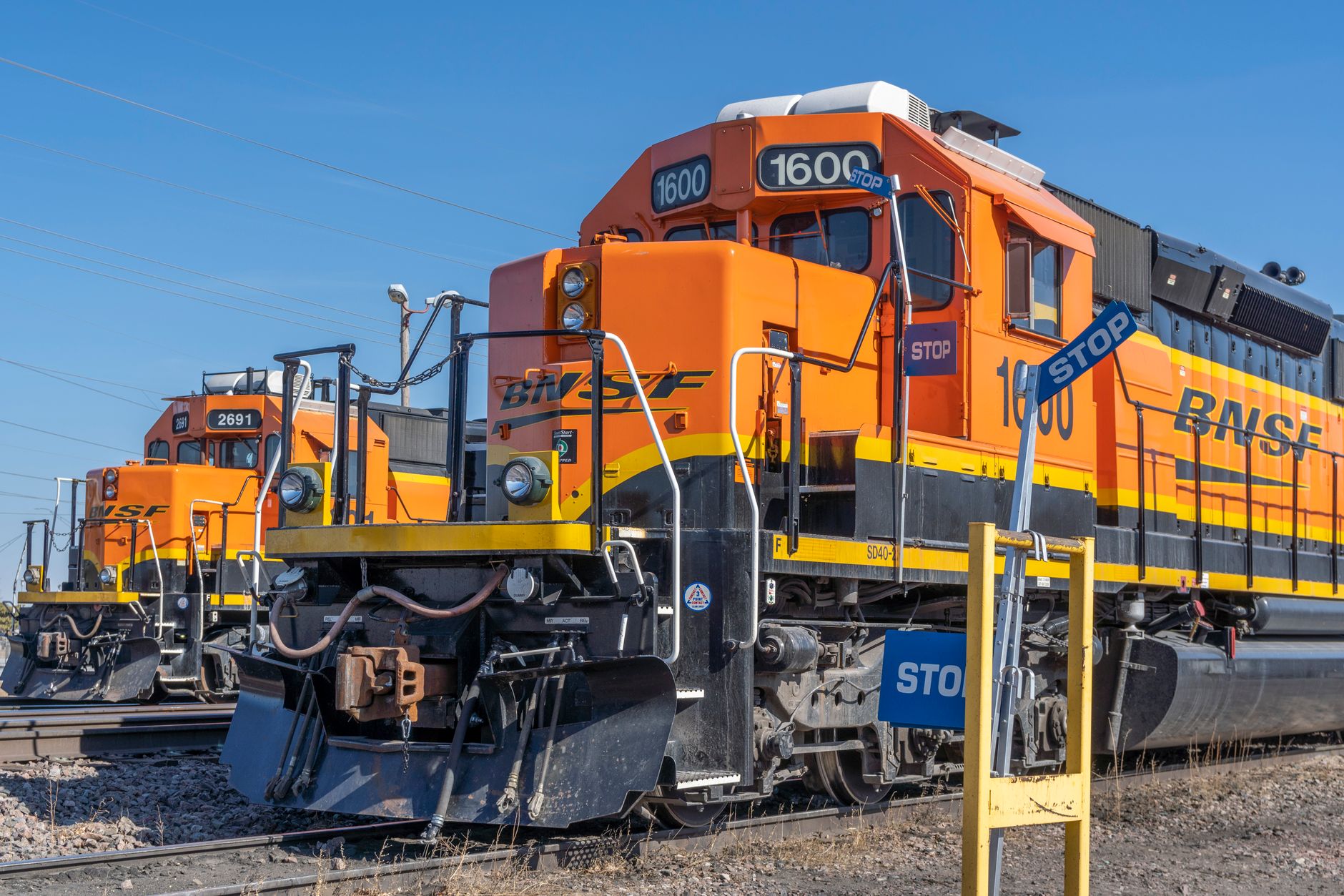 An industrial rail yard with multiple tracks and parked cargo cars