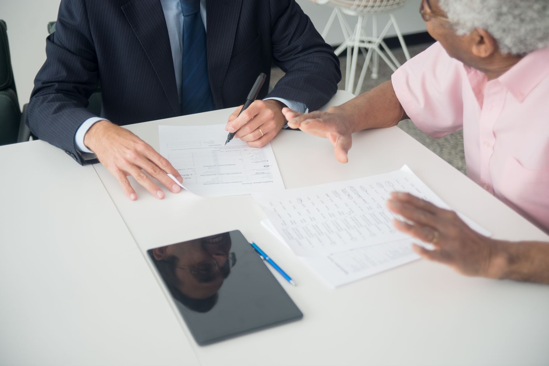 Institutional investors in a formal meeting reviewing asset allocation strategy