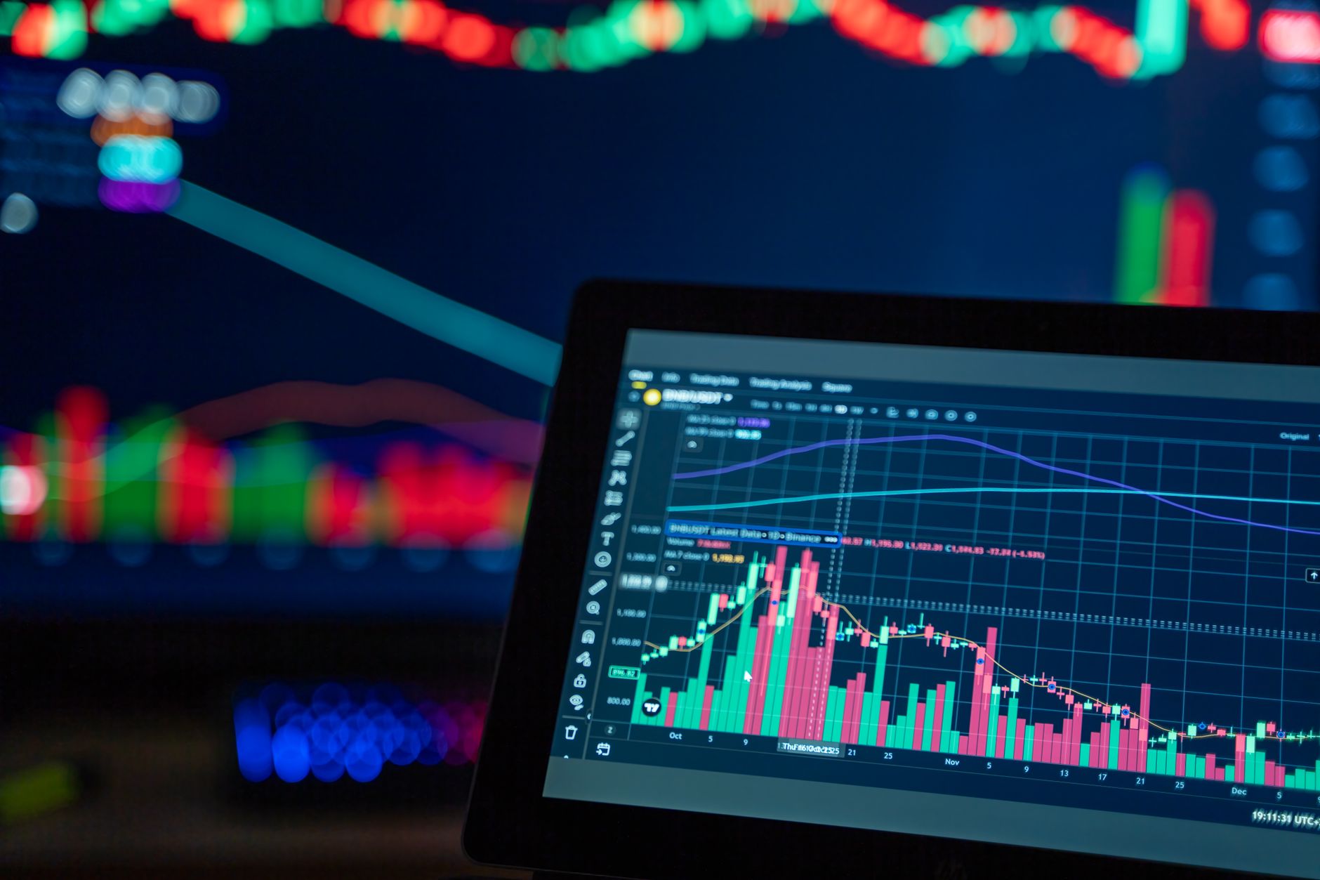 Financial professionals reviewing alternative investment data in a trading environment