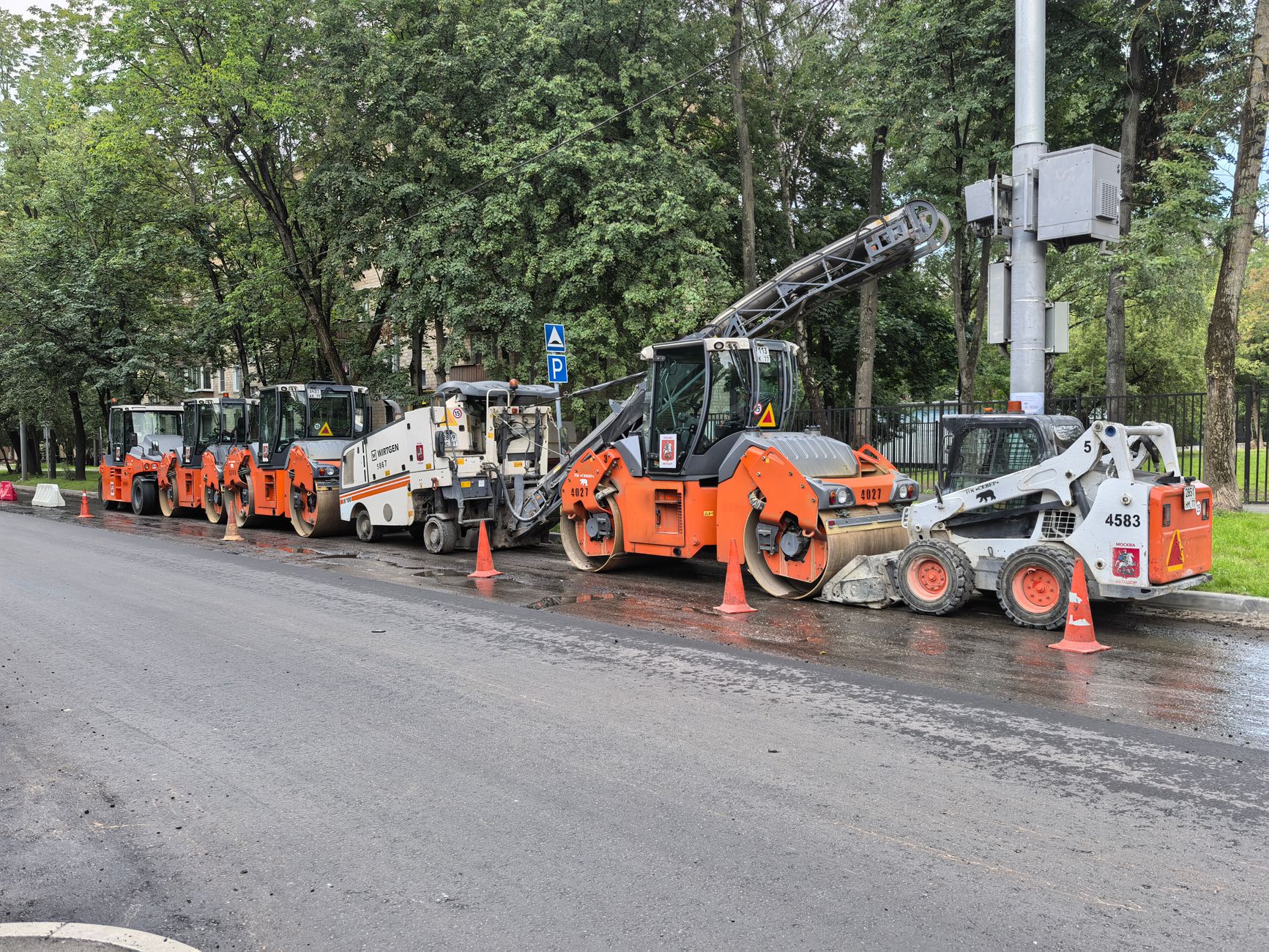 Construction crew laying asphalt on a highway paving project