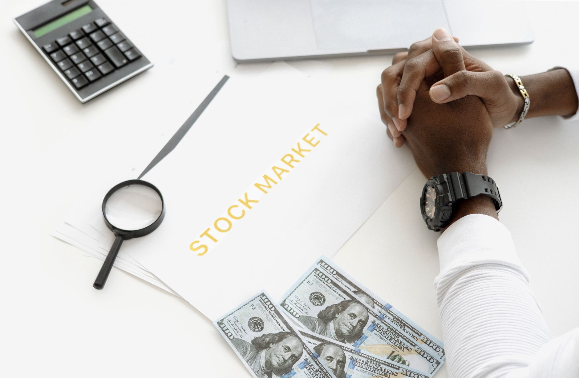 Finance professionals reviewing investment data and charts in a trading office
